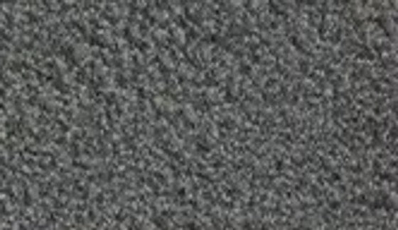 Close-up of the coarse head's dark, chunky grit